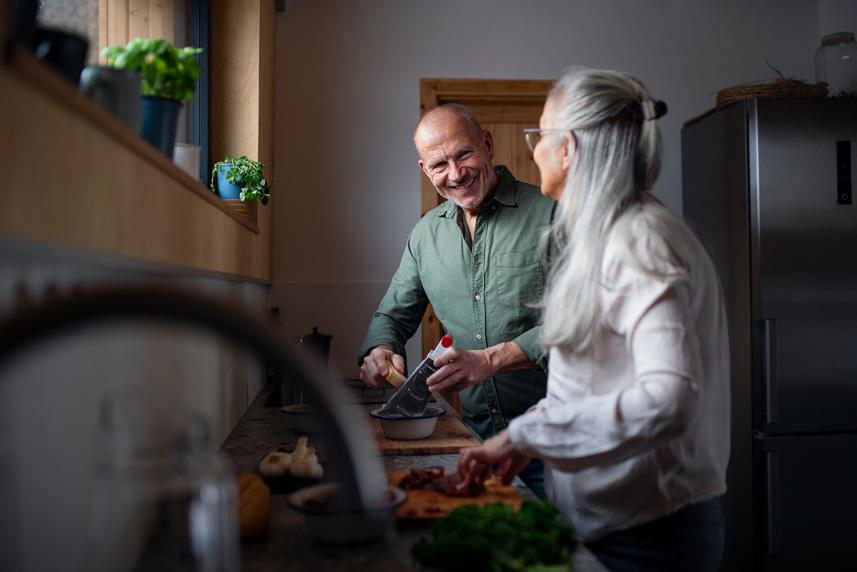 Senior couple doing dishes in kitchen together