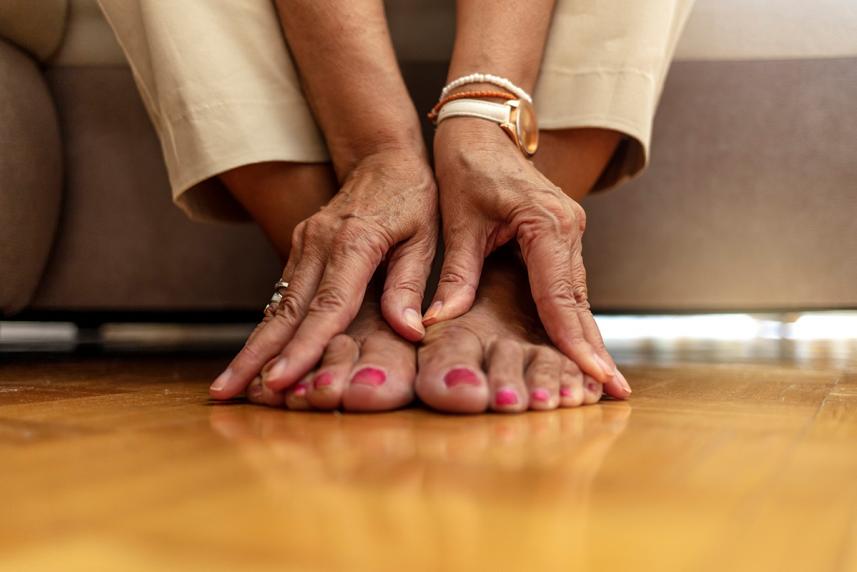 Woman touching her feet