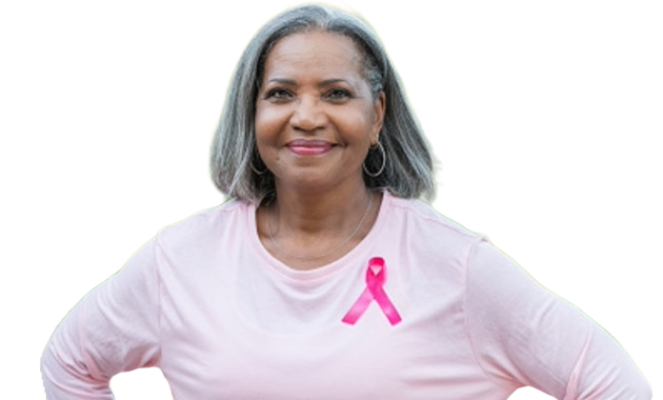 A women wearing a pink shirt and pink ribbon for Breast Cancer Awareness